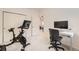 Bright bedroom featuring a workstation and exercise bike, perfect for a home office and fitness at 803 E 98Th Ave # 105, Thornton, CO 80229