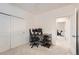 This bedroom features ample space for an office setup, neutral walls, and a nearby entry to another room at 803 E 98Th Ave # 105, Thornton, CO 80229
