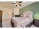 A spacious bedroom featuring neutral colors, plush carpet, ceiling fan, and views to other rooms at 803 E 98Th Ave # 105, Thornton, CO 80229