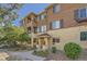 Attractive condominium with a well-manicured lawn, private balcony, and inviting curb appeal at 803 E 98Th Ave # 105, Thornton, CO 80229
