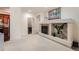 Bright living room featuring a fireplace and open floor plan into the kitchen, great for entertaining at 803 E 98Th Ave # 105, Thornton, CO 80229