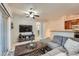 Inviting living room with a modern ceiling fan, neutral walls, and an abundance of natural light at 803 E 98Th Ave # 105, Thornton, CO 80229