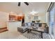 Cozy living room with modern decor, fireplace, and open layout to the kitchen, perfect for entertaining at 803 E 98Th Ave # 105, Thornton, CO 80229
