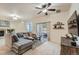 Spacious living room featuring stylish furnishings, fireplace, and a sliding glass door to a private patio at 803 E 98Th Ave # 105, Thornton, CO 80229