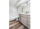 Bathroom featuring a shower-tub combo, large mirror, and modern vanity at 795 S Alton Way # 11C, Denver, CO 80247
