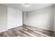 Cozy bedroom with wood-look floors, ample closet space, and neutral paint at 795 S Alton Way # 11C, Denver, CO 80247