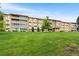 Low angle view of the brick complex with well maintained lawn at 795 S Alton Way # 11C, Denver, CO 80247