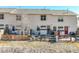 Private backyards with cozy patios, and fencing, creating ideal outdoor spaces for relaxation and enjoyment at 114 Vale St, Palmer Lake, CO 80133