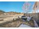 Cozy backyard featuring lawn and fence with views of the nearby mountains at 114 Vale St, Palmer Lake, CO 80133