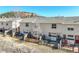 Private backyards with cozy patios, and fencing, creating ideal outdoor spaces for relaxation and enjoyment at 114 Vale St, Palmer Lake, CO 80133