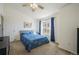 Bedroom with a blue comforter, carpet flooring, and view to the outside at 114 Vale St, Palmer Lake, CO 80133