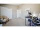 Bedroom features neutral paint, and an adjacent study area with a contemporary desk setup at 114 Vale St, Palmer Lake, CO 80133