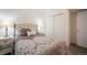 Bedroom featuring a bed, lamps, and closet, offering comfort and ample storage at 114 Vale St, Palmer Lake, CO 80133