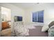 Inviting bedroom with a window view and ensuite bathroom provides a private and relaxing space at 114 Vale St, Palmer Lake, CO 80133