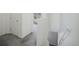 Upstairs hallway featuring neutral carpet, white walls and doors at 114 Vale St, Palmer Lake, CO 80133