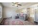 Comfortable living room with a sectional sofa, ceiling fan, and an open layout for seamless entertaining at 114 Vale St, Palmer Lake, CO 80133