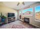 Living room showcases a fireplace, views, and a TV for cozy evenings at 114 Vale St, Palmer Lake, CO 80133