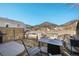 Enclosed backyard with a small patio and a mountain view, perfect for relaxation at 114 Vale St, Palmer Lake, CO 80133