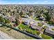 Expansive aerial view showcases homes, tree-lined streets, and spacious yards in a vibrant residential neighborhood at 3191 S Holly Pl, Denver, CO 80222