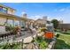 Outdoor patio featuring hanging swing chairs and manicured landscaping at 3191 S Holly Pl, Denver, CO 80222