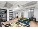 Finished basement bedroom with a geometric rug and shelving storage at 3191 S Holly Pl, Denver, CO 80222