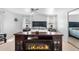 Comfortable bedroom with a fireplace, ceiling fan, and windows at 3191 S Holly Pl, Denver, CO 80222