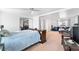 Large bedroom with an additional seating area and a queen sized bed at 3191 S Holly Pl, Denver, CO 80222