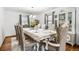 Dining room featuring formal seating, elegant chandelier, and plenty of natural light at 3191 S Holly Pl, Denver, CO 80222
