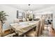 Dining room showcasing formal seating, elegant chandelier, and decor at 3191 S Holly Pl, Denver, CO 80222