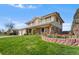 Beautiful two-story home with brick and siding exterior, landscaped yard and a two car garage at 3191 S Holly Pl, Denver, CO 80222
