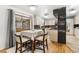 Bright kitchen with hardwood floors and modern appliances at 3191 S Holly Pl, Denver, CO 80222