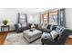 Comfortable living room showcasing hardwood floors and lots of natural light at 3191 S Holly Pl, Denver, CO 80222