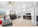 Expansive main bedroom featuring fireplace, ceiling fan, and sitting area at 3191 S Holly Pl, Denver, CO 80222