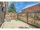 Enclosed backyard with a concrete patio, privacy fence, and an air conditioning unit at 8039 Wolff St # E, Westminster, CO 80031