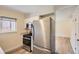 Efficient kitchen with stainless steel appliances, light cabinetry, and easy access to the living area at 8039 Wolff St # E, Westminster, CO 80031