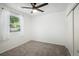 Bright bedroom with carpet flooring, a ceiling fan, and closet space at 1455 W Alaska Pl, Denver, CO 80223