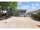 Exterior of home with covered porch and concrete driveway at 1455 W Alaska Pl, Denver, CO 80223