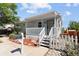 Charming single-Gathering home boasts a covered front porch and fenced yard at 1455 W Alaska Pl, Denver, CO 80223