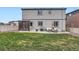 Large backyard with a patio, outdoor seating, grill, and a pergola, ideal for entertaining and leisure at 12815 Randles Ave, Parker, CO 80134