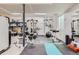 Finished basement featuring a home gym setup with various exercise equipment and accessories at 12815 Randles Ave, Parker, CO 80134