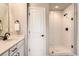 Modern bathroom featuring a walk-in shower with white subway tile and matte black fixtures at 12815 Randles Ave, Parker, CO 80134