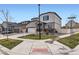 View of the charming two-story home on a corner lot with a well-maintained lawn at 12815 Randles Ave, Parker, CO 80134