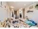 Open upstairs landing showcases an animal-themed rug, reading nook, and a -safe gate at 12815 Randles Ave, Parker, CO 80134