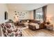Cozy living room with stylish decor, a comfortable leather sofa, and plenty of natural light at 12815 Randles Ave, Parker, CO 80134