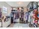 Walk-in closet with ample storage, organized shelving, and natural lighting at 12815 Randles Ave, Parker, CO 80134