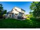 Expansive backyard with a lush lawn, a hot tub, and a spacious wooden deck at 3232 Cimarron Pl, Superior, CO 80027