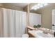 Neutral bathroom featuring a shower/tub combo, updated vanity and a decorative mirror at 3232 Cimarron Pl, Superior, CO 80027