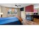 Spacious bedroom with a fireplace, large windows, and comfortable furniture at 3232 Cimarron Pl, Superior, CO 80027