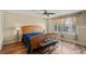 Cozy bedroom with a wooden bed frame, a ceiling fan, and plenty of natural light at 3232 Cimarron Pl, Superior, CO 80027