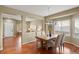 Open-concept dining area with hardwood floors and a seamless transition to the living area at 3232 Cimarron Pl, Superior, CO 80027
